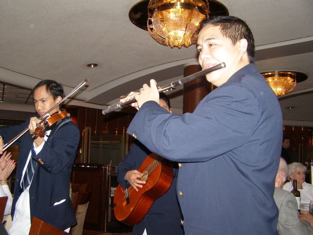 Musicians Serenade a Table of Diners