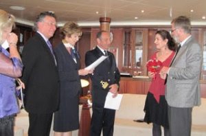 Couple stands with officials for surprise vow renewal ceremony