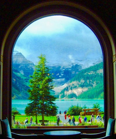 Great View from The Lakeview Lounge of mountains, lake, and trees.