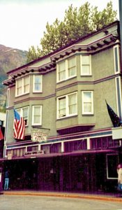 Old brownish-green hotel in Alaska