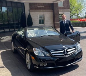 AFFABLE DOORMAN BRON WELCOMES GUESTS TO THE HOTEL